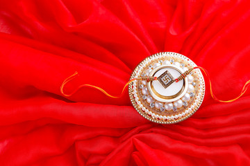 Raksha bandhan rakhi on red background