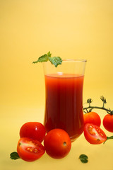 tomato juice on yellow background.