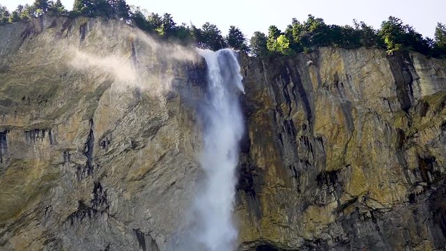 a falling waterfall from a mountain 300 meters high.