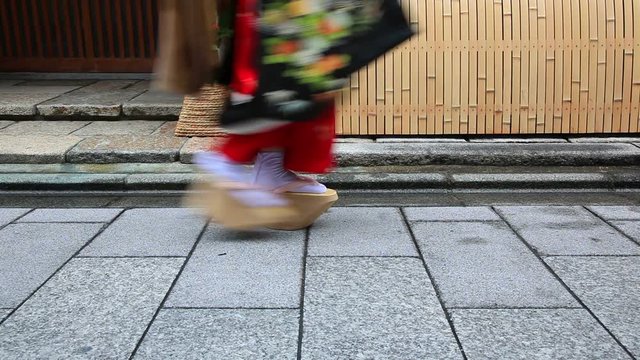 Close up of feet of maiko walking in slow motion