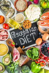 Pescetarian diet plan ingredients, healthy balanced grocery food, fresh fruit, berries, fish and shellfish clams, white marble background copy space 
