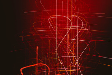 Blur neon red, white, orange glowing scratches. Illuminated lines. Dark abstract background.