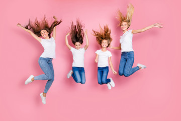 Full length body size view of four nice attractive careless slim fit cheerful long hair glad girls...