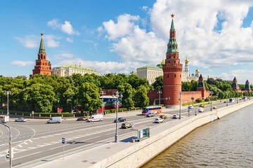 Fototapeta premium Moscow Kremlin against Kremlevskaya embankment of Moskva river in sunny summer morning