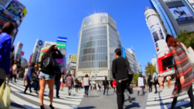 Fisheye view of people walking across pedestrian crossing