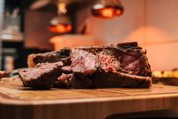 Delicious food. Roast beef on a wooden cutting board.
