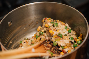 Cooking delicious food, paella, close-up.