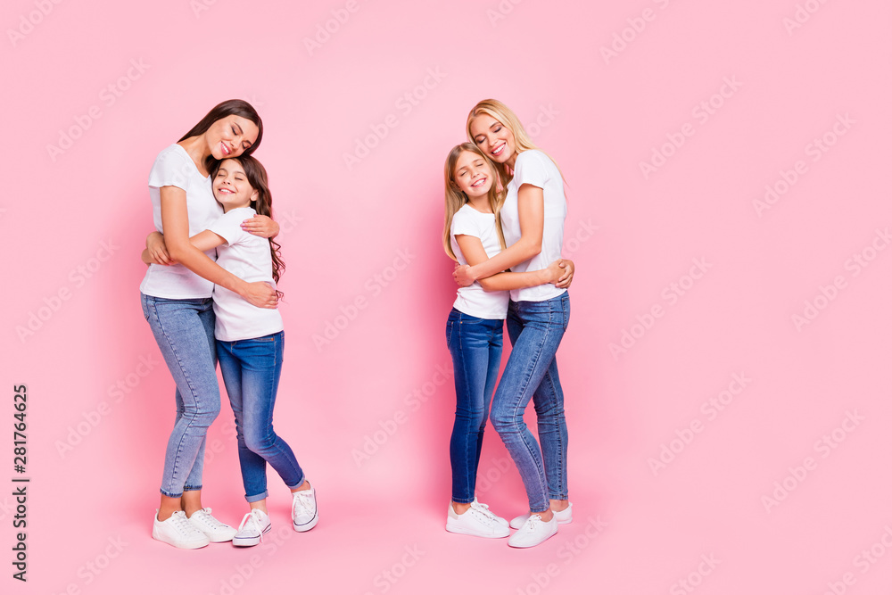 Sticker Full size photo of four different age ladies hugging overjoyed wear casual outfit isolated pink background