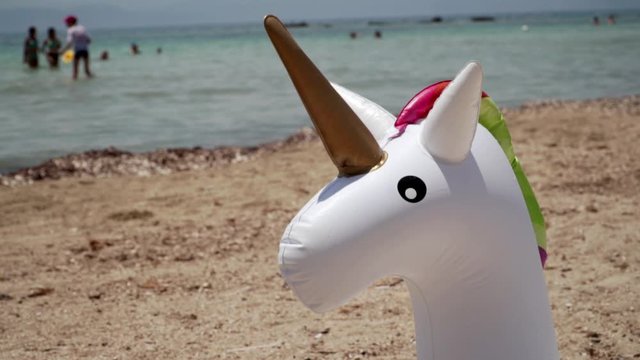 Unicorn swim tube Inflatable. Fantasy Swim Ring for Summer Pool Trip. Sand