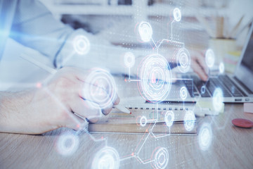 A man working on computer with technology theme drawing. Concept of big data. Multi exposure.