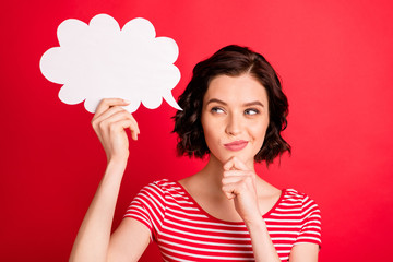Photo of beautiful girl holding white cloud pretending to be thinking something over while isolated with red background