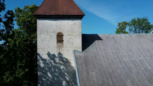 Aerial Dron Shot of the Cirava Lutheran Church Aizpute  Latvia, Sunny Summer Day. Flaying Above the  Church and Manor Castle.