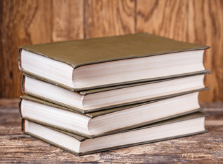 Education concept - books on the desk in the auditorium