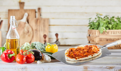 Preparing a traditional Italian pizza