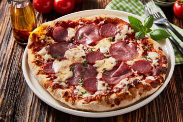 Tasty salami or pepperoni pizza on a crispy base