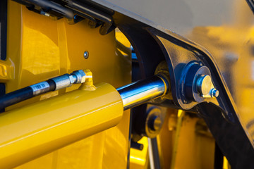 Hydraulic piston system for bulldozers, tractors, excavators, chrome plated cylinder shaft of yellow machine, construction heavy industry detail