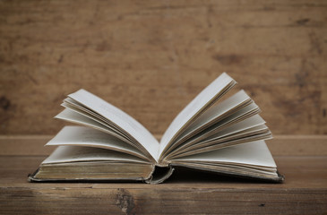 antique books on old wooden shelf.
