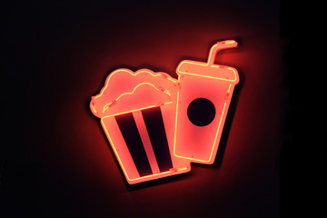 neon sign in cinema. There is a bar, popcorn, drinks