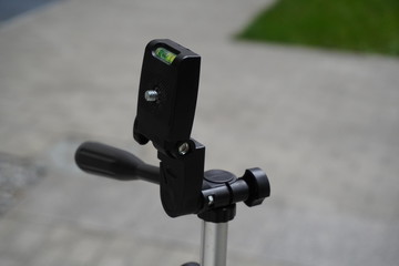 tripod for phone or camera. the equipment of the photographer, used to shooting video or photos, of yourself or other people, selfie
