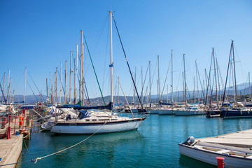 Fototapeta na wymiar Beautiful yachts in the port of Agios Nikolaos, Mirabello Bay, Crete, Greece