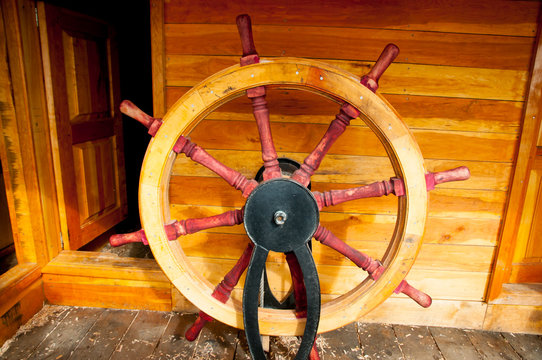 Steering Wheel on Wooden Ship