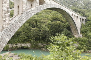 Fototapeta premium Solkan stone railway bridge in Slovenia over the river Soсa