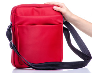 Red messenger bag in hand on white background isolation