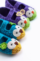  Women's hobby. Crochet and knitting. Working space. Cozy colorful Slippers in the form of owls for the home.