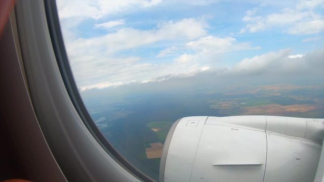 View from the window of a passenger airplane of a landscape
