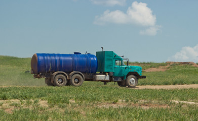 Side view of a water truck. creative water truck. on the tank you can make any creative inscription.