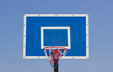 basketball shield in the open air . Outdoor basketball ring in front of blue sky background. Sport concept.