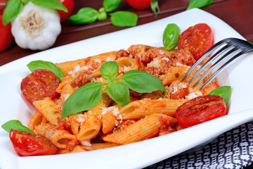 Pasta with spicy tomato sauce, parmesan and basil