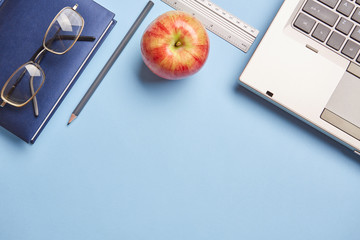 Desktop for student with a computer and an apple