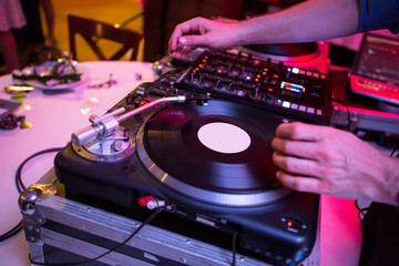 Fototapeta na wymiar Disco DJ play LP on party