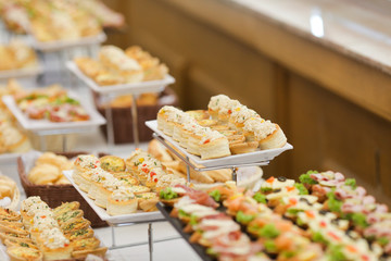 Shallow depth of field image with appetizers on a table at an event, provided by a catering company
