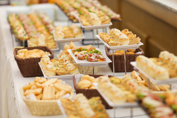Shallow depth of field image with appetizers on a table at an event, provided by a catering company