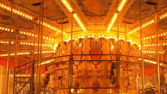 Beautiful brightly glowing carousel on the Red Square decorated and arranged for Christmas and New Year. Christmas fairy illuminated turnabout . Luminous roundabout rotates. Wonderful magic xmas