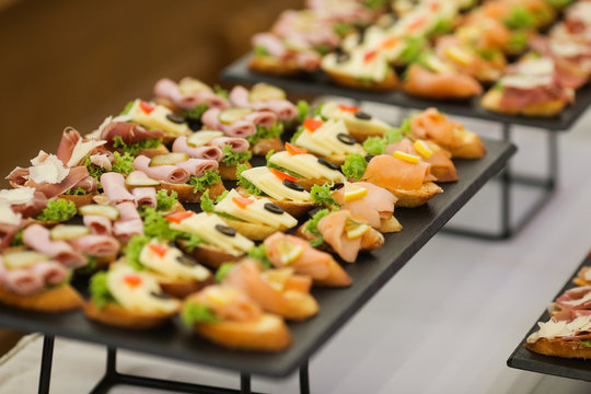 Shallow depth of field image with appetizers on a table at an event, provided by a catering company