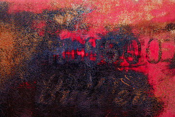 Red and black painted old metal surface