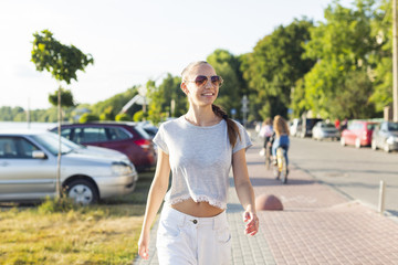 Front view woman with sunglasses walking