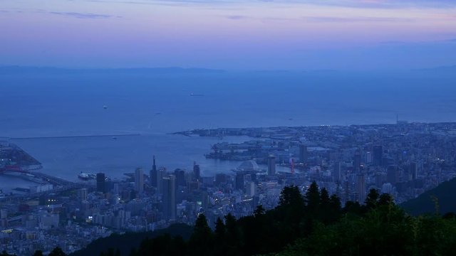 High angle view of Kobe cityscape at dusk, Japan