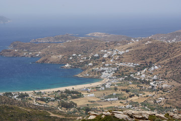 Greece, the holiday island of Ios. A view of Mylopotos beach from the surrounding mountains on a summers day