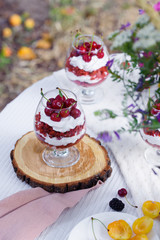 Red velvet dessert in beautiful glasses decorated with cherry