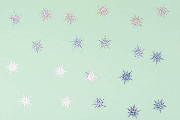 Festive and shiny background. Little stars on a light green background.