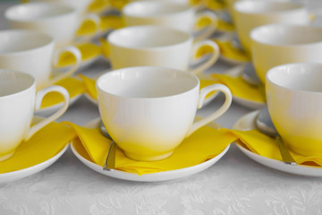 A couple of cups and saucers in the cafe. Utensils for drinking tea and coffee.