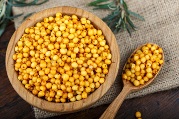 sea buckthorn in a plate and in a spoon