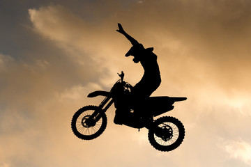 Obraz na płótnie Canvas freestyle motocross at sunset