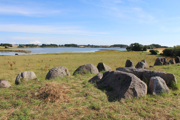 View of the Long barrow neolithic stones and the surrounding countryside at Norreballe Nor near Humble, Langeland, Denmark.