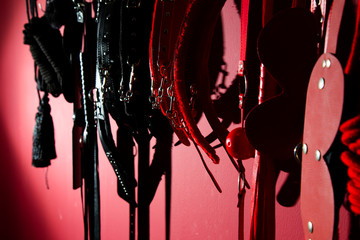 erotic games and human sexuality concept. kinky sex toys for  BDSM fantasy play (ball gag, cuffs,...