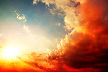 red sunset, bright summer background with sun rays